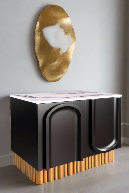 sculptural black  and white accent chest with gold base 